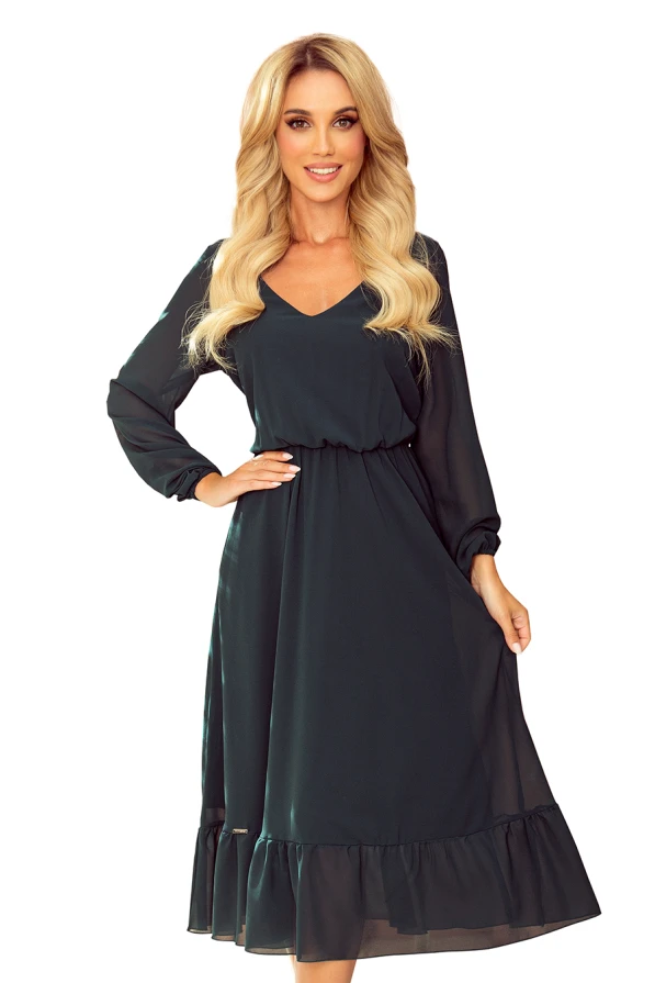 Sieviešu šifona midi kleita tumši zaļā krāsā ar garām piedurknēm un volāniem apakšmalā. Kleita ir eleganta un piemērota gan ikdienas, gan svētku pasākumiem.