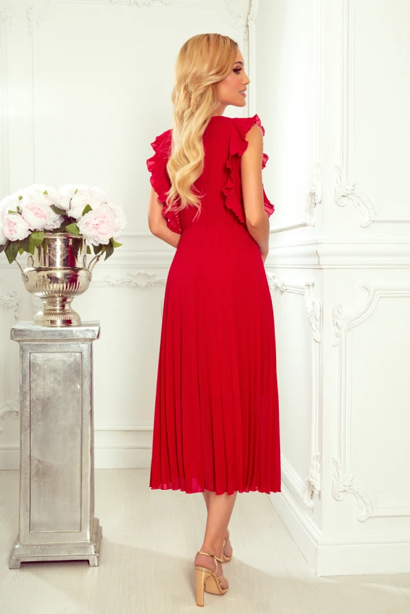 Sieviešu sarkanā plisētā kleita ar volāniem uz pleciem piešķir eleganci un izsmalcinātību. Kleita ir garumā līdz ikriem, ideāli piemērota svinīgiem pasākumiem.