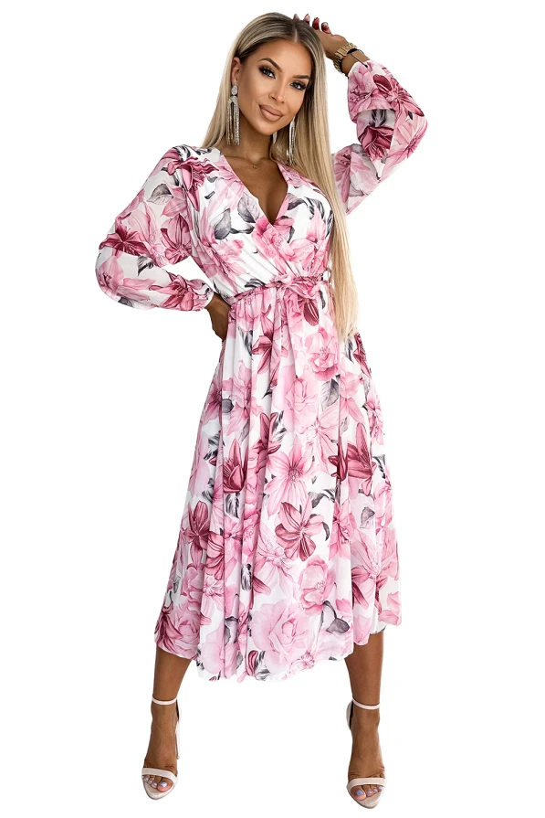 Sieviešu šifona midi kleita ar ziedu rakstu rozā un pelēkos toņos, kas piešķir eleganci un sievišķību. Kleitai ir garas piedurknes un josta, kas izceļ vidukli.